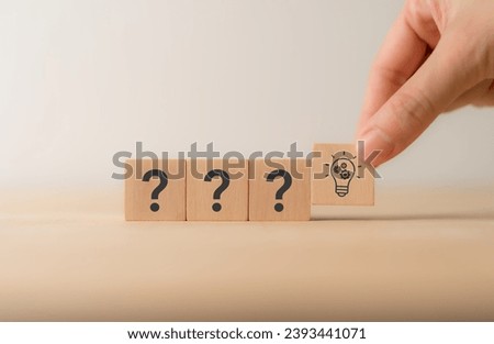 Question marks and light bulb symbolizing idea or solution. Problem solving skill, creativity, innovation, brainstorming, critical thinking and root cause analysis concept. Question, idea and answer.