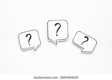 Question marks on speech bubbles, top view. Ask and answer concept