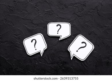 Question marks on speech bubbles, top view. Ask and answer concept