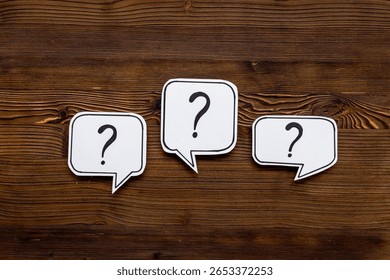 Question marks on speech bubbles, top view. Ask and answer concept - Powered by Shutterstock - Get 15% off with code: PIKWIZARD15