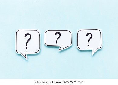 Question marks on speech bubbles, top view. Ask and answer concept