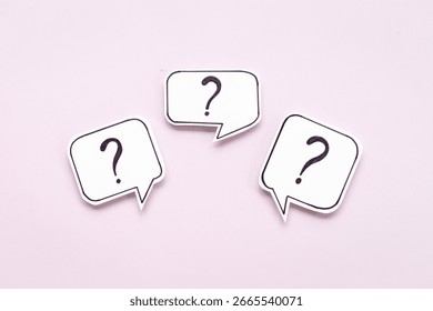 Question marks on speech bubbles, top view. Ask and answer concept