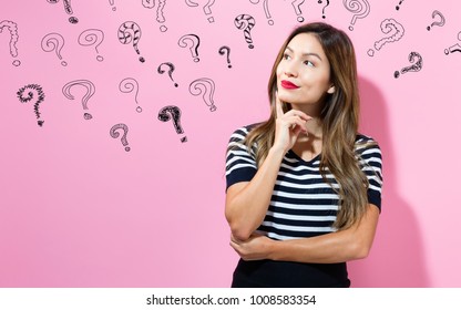 Question Marks with young woman in a thoughtful pose