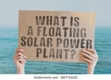 The question " What is a floating solar power plant? " on a banner in men's hand with blurred sea on the background. Sun. Technology. Innovation. Future. Sustainable environment