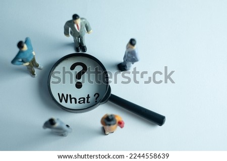 questioning,investigation,inquiry, analysis,problem solving,critical thinking,creativity, innovation,brainstroming concept.,A group of business people looking a magnifying glass and focus on what?.