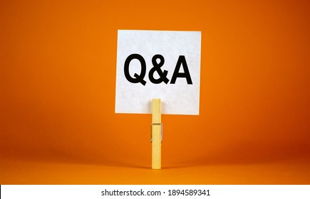 Questions and answers symbol. White paper. Words 'Q and A, Questions and answers'. Beautiful orange background. Business and Q and A, questions and answers concept, copy space.