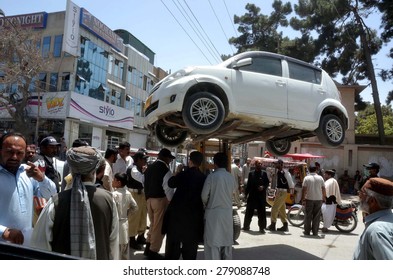 QUETTA, PAKISTAN - MAY 18: Traffic Police Car Lifter Lifts Car That Parked In No Parking Area Caused Obstacle In Smooth Flow Of Traffic Jam At Adalat Road In Quetta On Monday, May 18, 2015. 