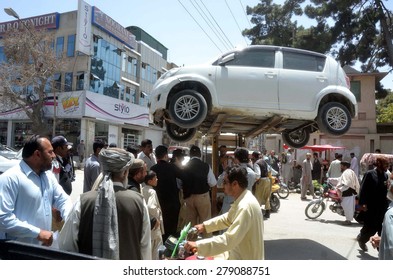 QUETTA, PAKISTAN - MAY 18: Traffic Police Car Lifter Lifts Car That Parked In No Parking Area Caused Obstacle In Smooth Flow Of Traffic Jam At Adalat Road In Quetta On Monday, May 18, 2015. 