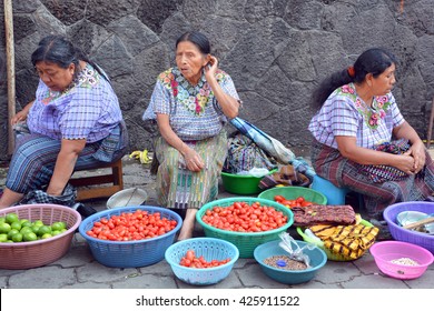 QUETZALTENANGO GUATEMALA APRIL 28 2016 : People sell fruits in Quetzaltenango maket. This native market is the most colorful in Central America