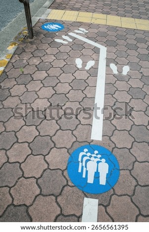 Queue Line Marking on Japanese Sidewalk for Public Bus Transportation