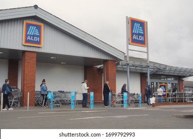 A Queue Of People Obeying The New Social Distancing Rules Outside Aldi Supermarket During The First COVID 19 Lockdown. BOSTON Lincolnshire UK, April 2. 2020 