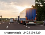 Queue of Trucks on Ukraine-Poland Border traffic jam at Sunset During Protest Roadblock. Business agricultural Logistics blockade action. Cargo lorry semi-trailers stuck