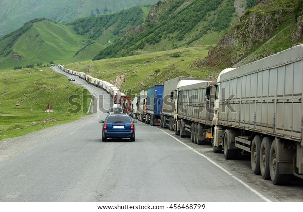 Queue of trucks waiting in line\
for border customs control, Georgian Military Road,\
Georgia.\
