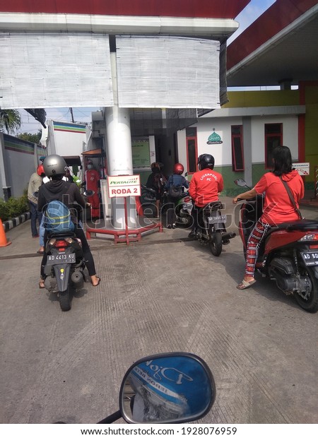 queues for filling fuel in Solo City,\
Central Java Province, Indonesia on March 3,\
2021