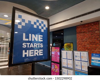 QUEZON CITY, PHILIPPINES - 09/11/2019: Line Starts Here Signboard At The Cinemas Of SM City North EDSA, The Philippines Largest Mall Chain.