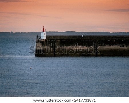 Quiberon, France August 2023. Sunset over the ocean in Quiberon, vacation in the background white lantern, warm sky tone
