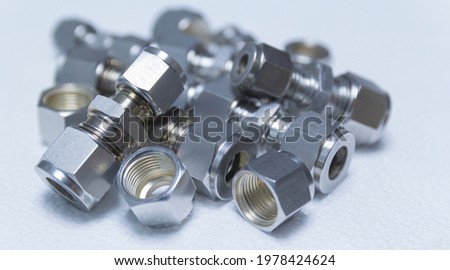 Quick connect fittings coupling for assembling compressed air, hydraulics, pneumatics, gases, fuel lines.Close up. Selective focus.