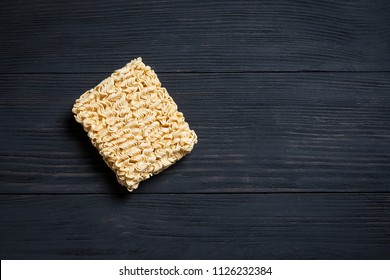 Quick cooking noodle is one on a black background with copy space - Shutterstock ID 1126232384