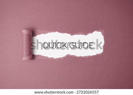 Quick Guide, on torn pink paper