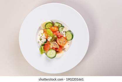 Quick And Healthy Food Recipes. Salad With Salmon, Vegetables, Herbs And Capers On White Plate. Mediterranean Dish Recipes. Top View. Copy Space