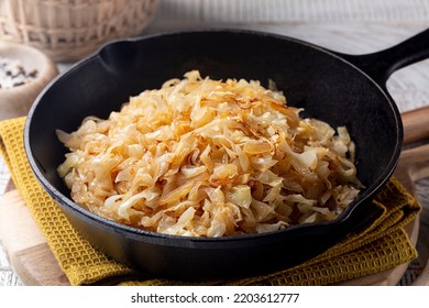 Quick Pan fried Sauerkraut or Crauti. Finely cut white cabbage cooked with fried onion and white wine. Close-up. - Shutterstock ID 2203612777