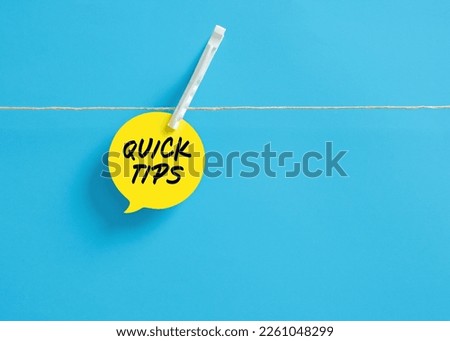 Quick tips on a speech bubble hanging on clothesline with a clothespin.