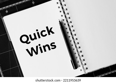 Quick Wins Memo Written In A Notebook With Pen 