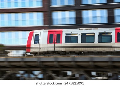 Quickly Speeding Metro Train On Raised Track