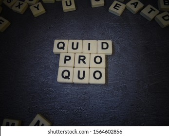 Quid pro quo (in Latin), word cube with background.