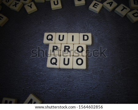 Quid pro quo (in Latin), word cube with background.