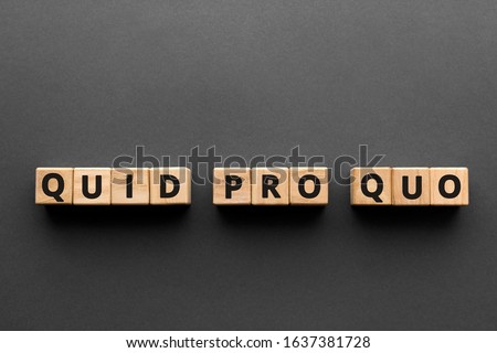 Quid pro quo - words from wooden blocks with letters, 