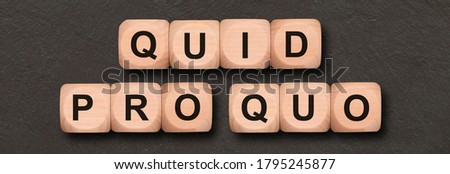 quid pro quo written on wooden cubes