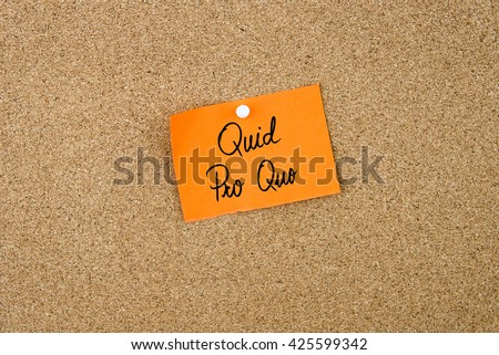 QUID PRO QUO written on orange paper note pinned on cork board with white thumbtacks, copy space available