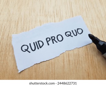 Quid pro quo writting on table background.