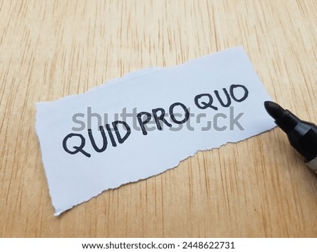 Quid pro quo writting on table background.