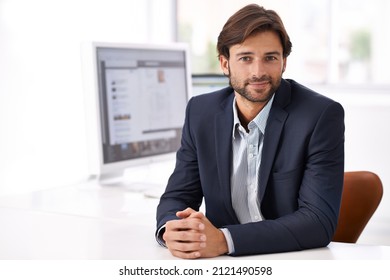 Quiet Confidence. A Handsome Businessman Smiling At The Camera.