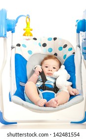 Quiet Cute Baby Boy In A Swing Home Against White Background