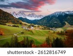 A quiet evening in the village of St. Magdalena, located among the rocky mountains. Val di Funes, National park Puez Odle, Dolomites, Italy, Europe. Photo wallpaper. Discovery the beauty of earth.