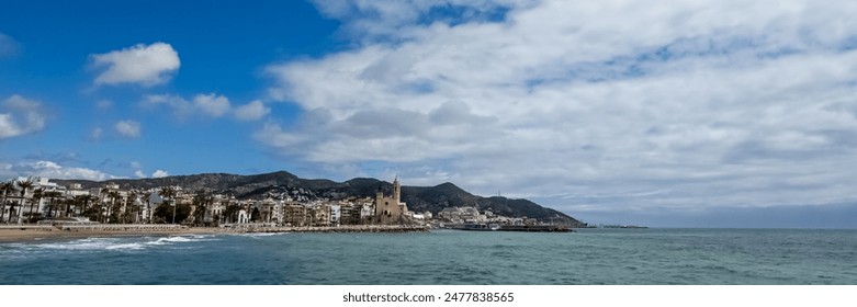 Quiet Mediterranean coastline with historic European architecture under a blue sky, ideal for travel and summer holiday themes - Powered by Shutterstock