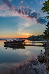 Quiet Peaceful Fishing Boat At The Dock At The Cottage In Kawartha Lakes Ontario Canada On Balsam Lake