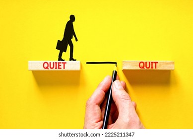Quiet quit symbol. Concept words Quiet quit on wooden blocks. Beautiful yellow table yellow background. Businessman hand. Businessman icon. Business and quiet quit concept. Copy space. - Shutterstock ID 2225211347