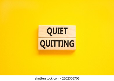 Quiet Quitting Symbol. Concept Words Quiet Quitting On Wooden Blocks. Beautiful Yellow Table Yellow Background. Business And Quiet Quitting Concept. Copy Space.