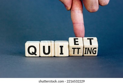 Quiet quitting symbol. Concept words Quiet quitting on wooden cubes. Businessman hand. Beautiful grey table grey background. Business quiet quitting concept. Copy space. - Shutterstock ID 2216532229