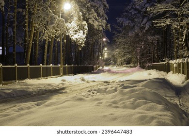 A quiet street in Riga at night after a snowfall - Powered by Shutterstock