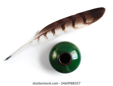 Quill pen with a glass bottle of ink isolated on white background. Feather for calligraphy, old education, vintage fonts. Top view. - Powered by Shutterstock