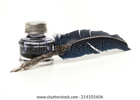 Quill pen and inkwell isolated on white.