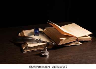 Quill Pen And Inkwell Resting On An Old Book Concept For Literature, Writing, Author And History