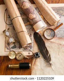 Quill pen on an old map and vintage items
