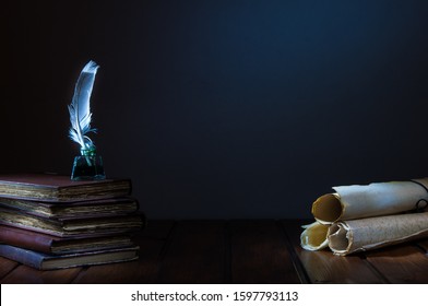 Quill pen and rolled papyrus sheets on a wooden table with old books