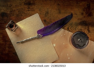 A Quill Pen With A Vintage Ink Well, Old Paper, And A Black Candle, Overhead Flat Lay Shot